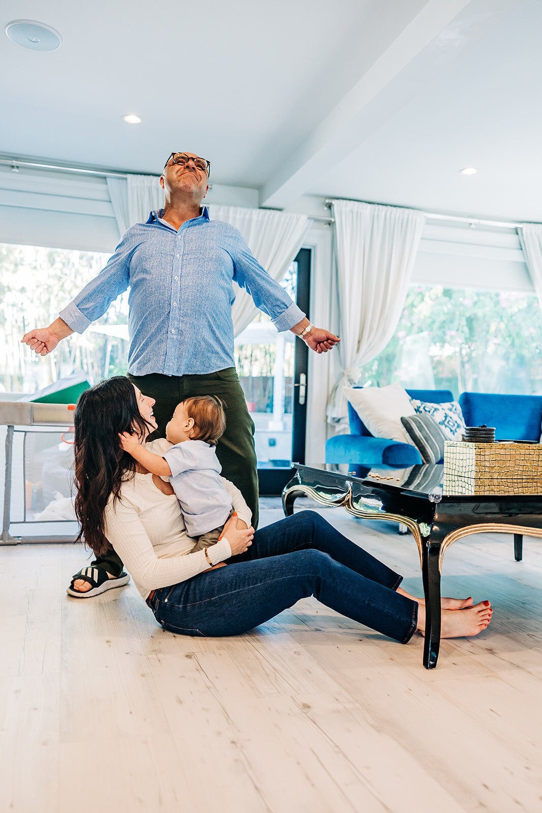 St. Pete family photographer takes bright airy fun photo of family in home near st. pete