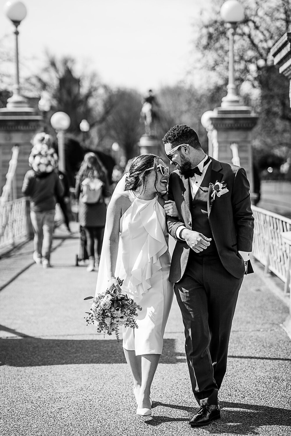 elopement couple laugh together in boston public garden