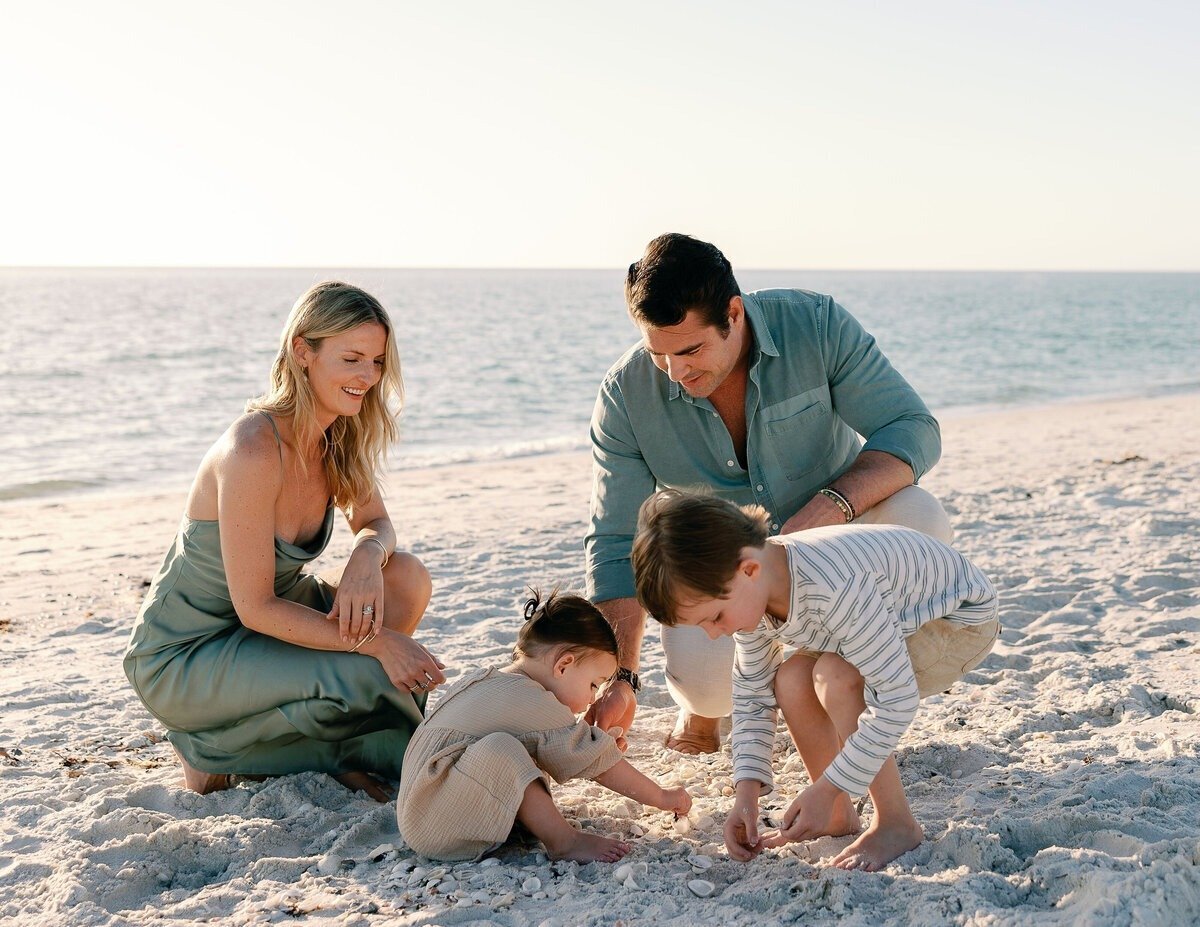 family playing on beach in Naples, Florida