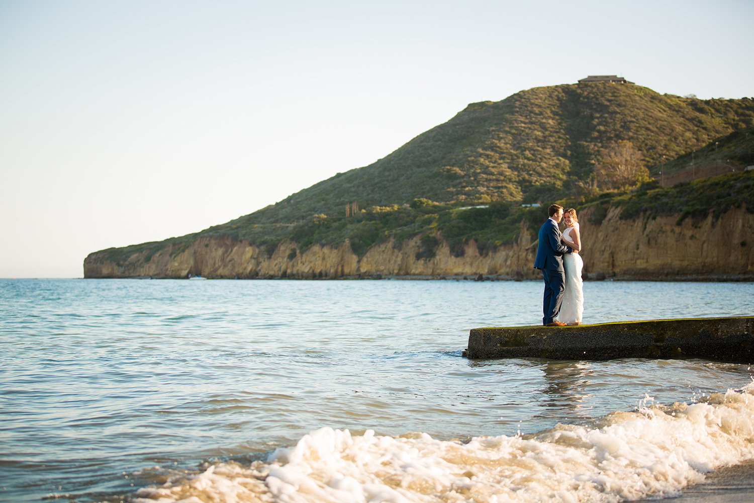 couple with ocean in back ground at ocean view room