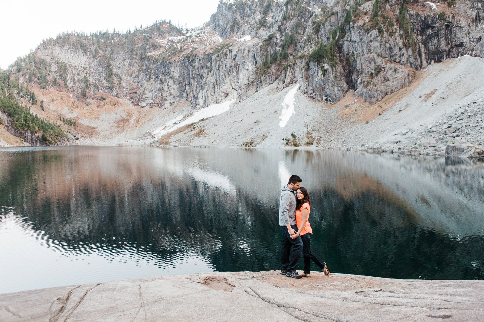 A couple takes a hike together to Lake Serene near Stevens Pass with adventure elopement photographer Amy Galbraith