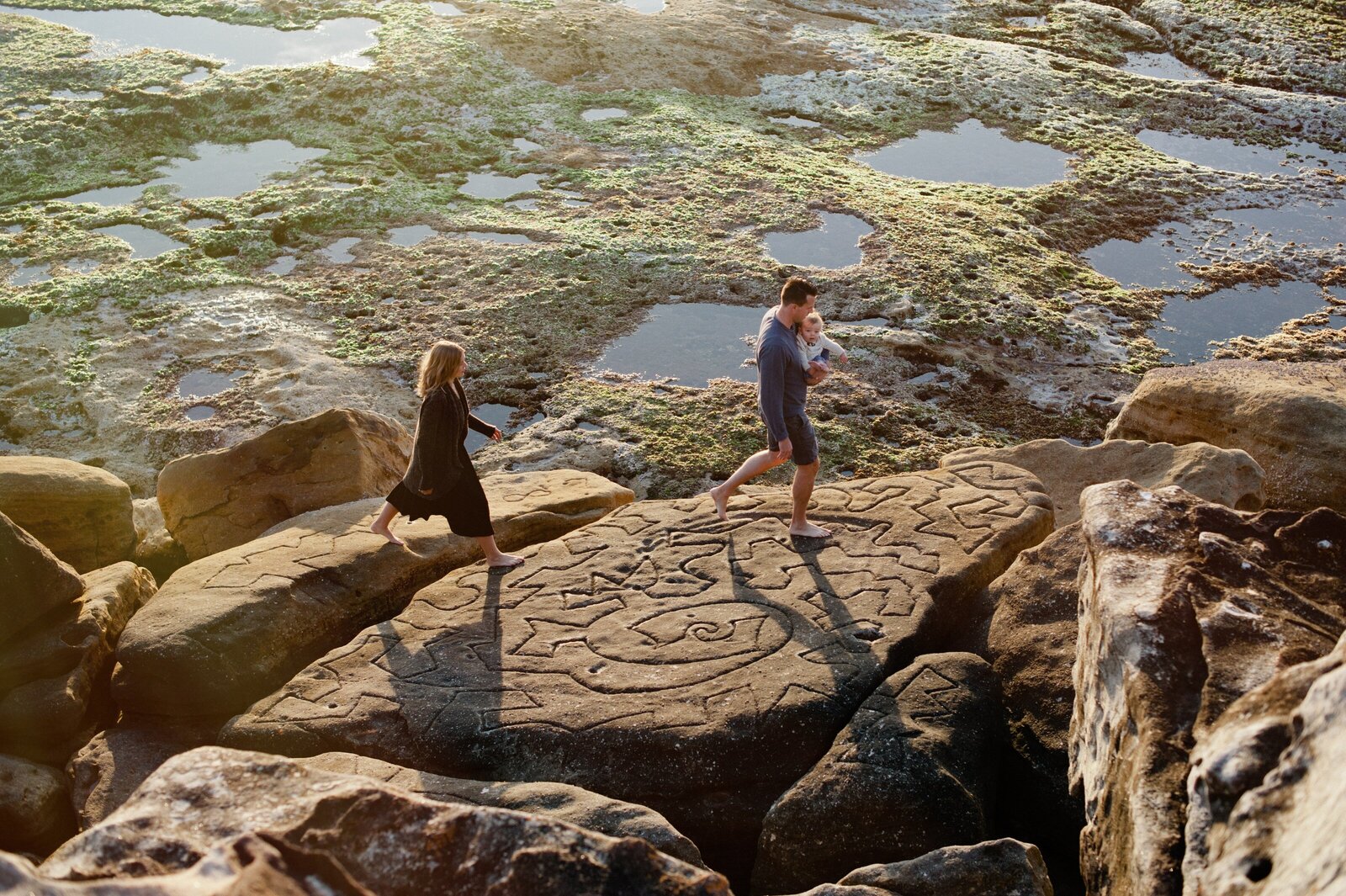A peaceful walk by the water, part of a heartfelt family photoshoot in Sydney