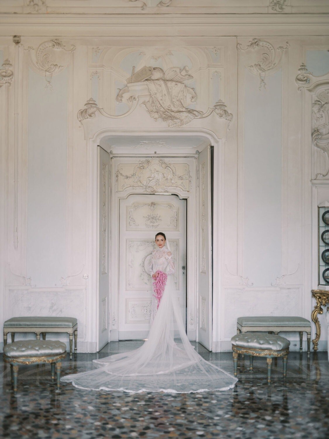 Bride standing in Fresco Room in villa Sola Cabiati, holding a bouquet, by Lake Como wedding photographer Andreas K. Georgiou