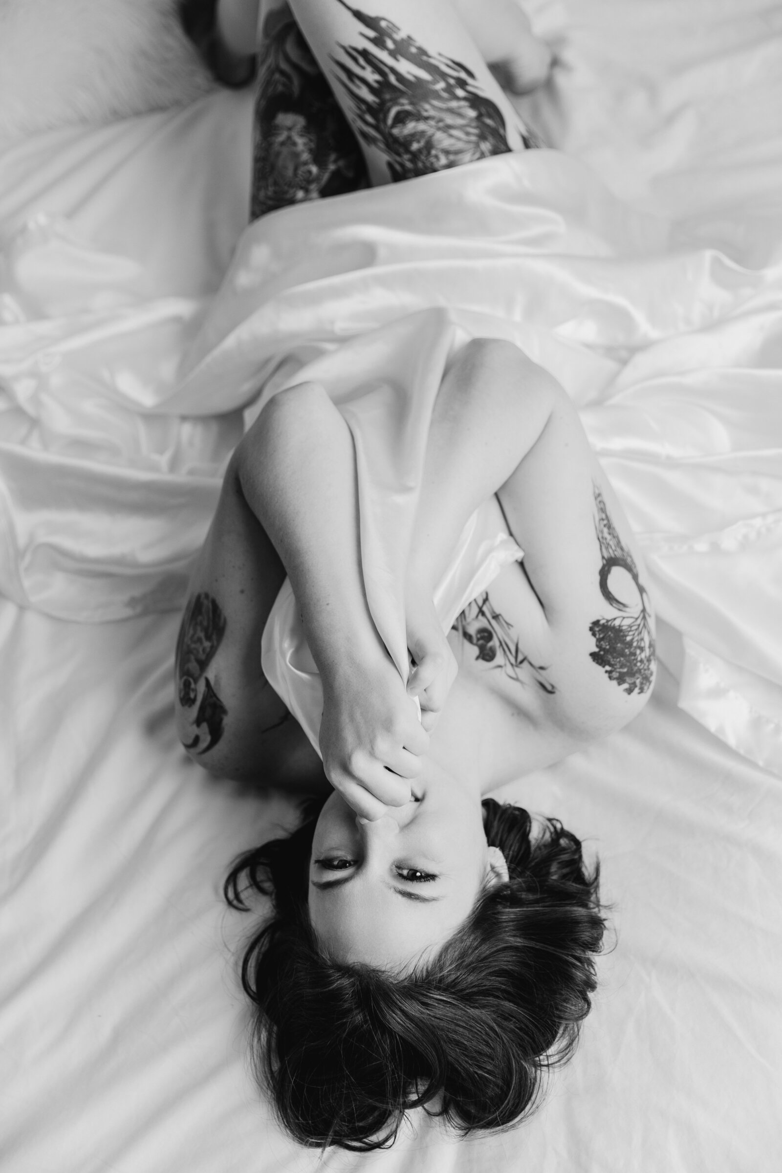 confident woman flirting with a white sheet