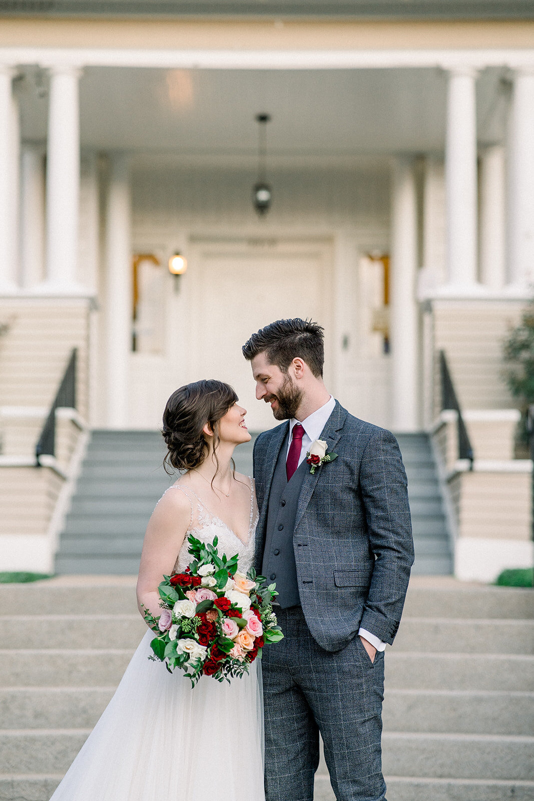 This elegant photo by Tiffany Longeway captures a beautiful wedding moment in Sacramento, showcasing the couple's love and joy amidst the city's blend of modern and historical settings.