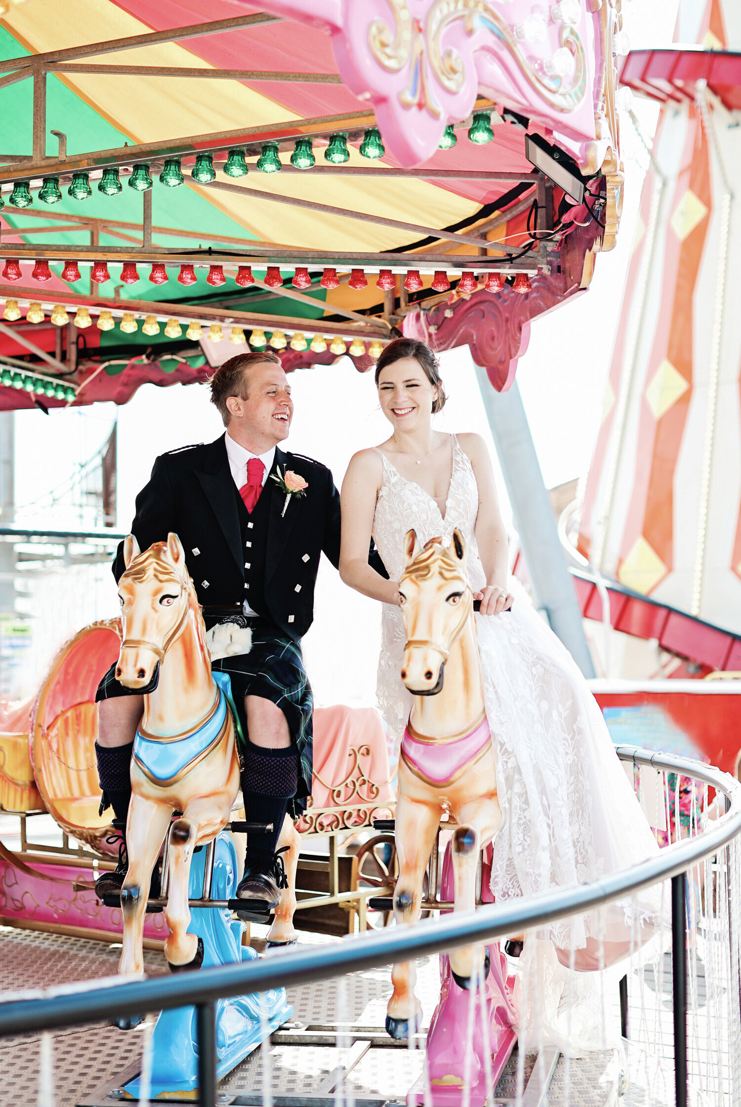 bride-and-groom-Bournemouth-Pier-wedding-merry-go-round