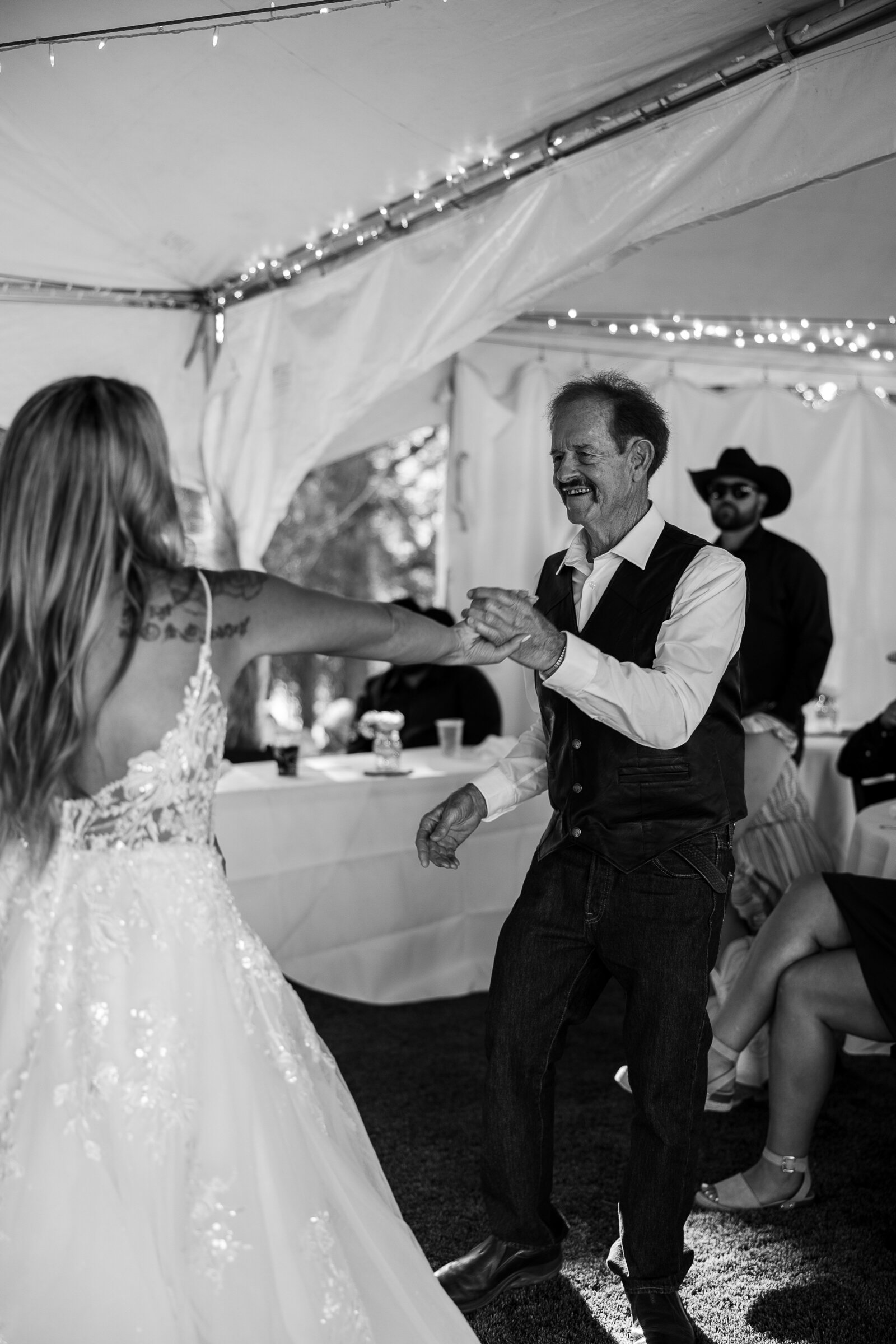 Bride and grandpa share a fun sweet first dance together at her wedding