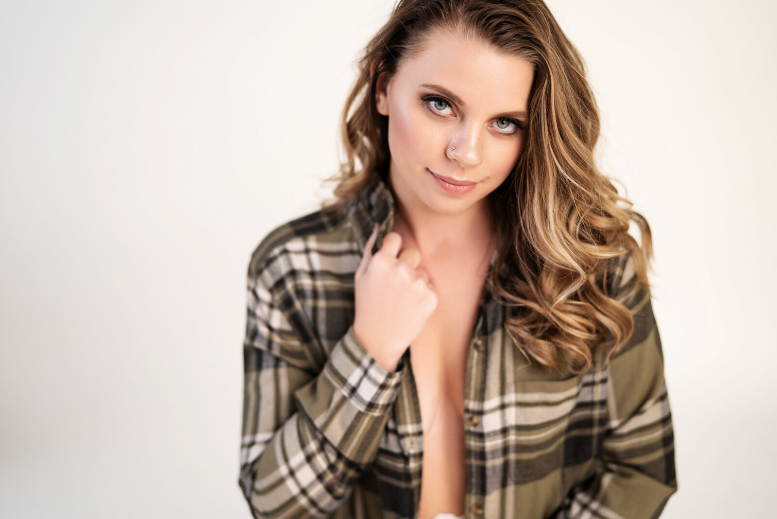 woman in green flannel boudoir session