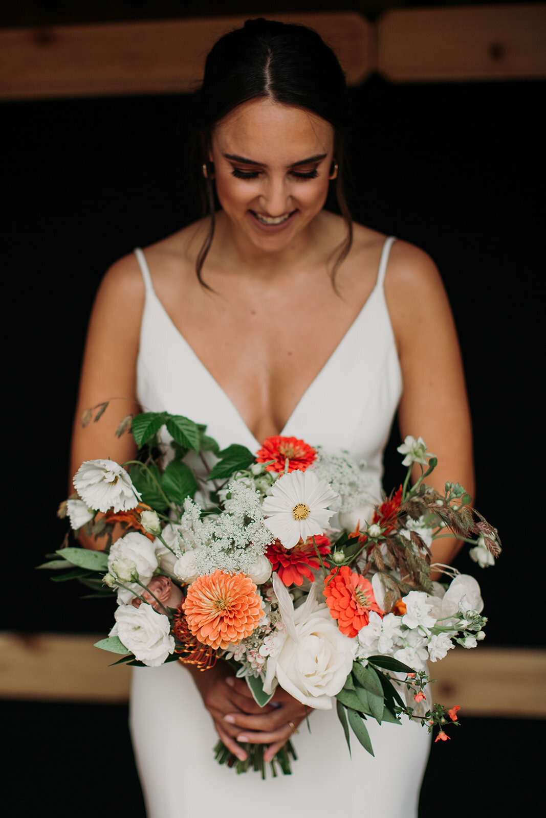 A bride holding a bouquet of flowers.