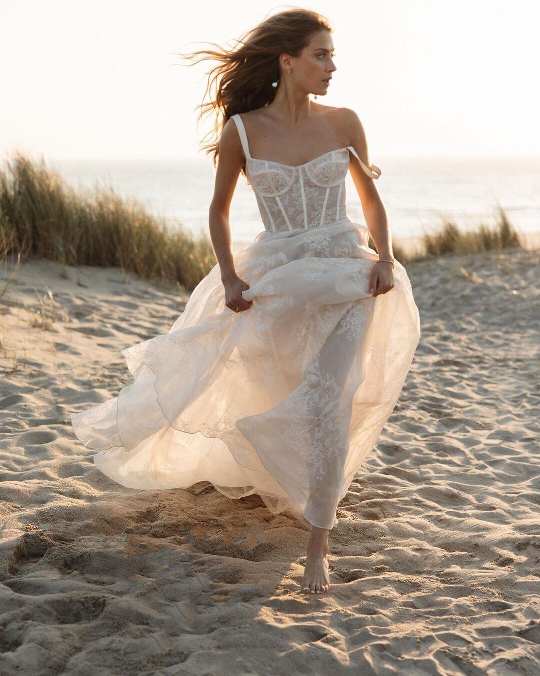 bride wearing lace corset wedding dress