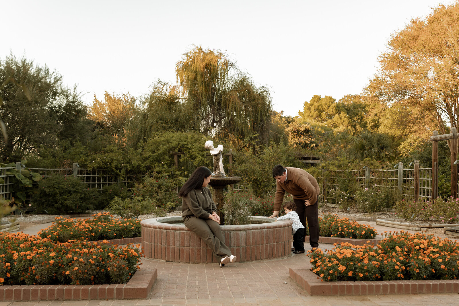 family of three at botanical gardens