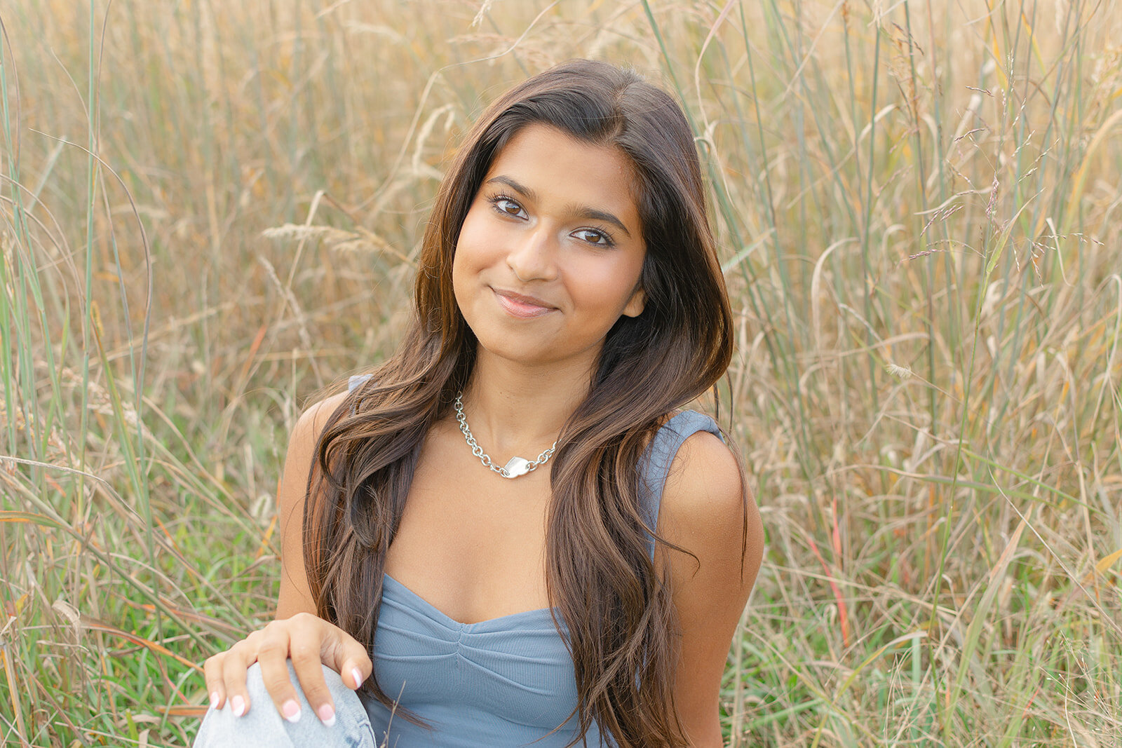 girl sitting on grass in Centreville, Virginia