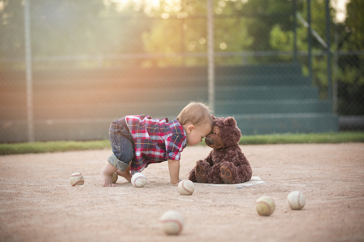 1st birthday photoshoot on baseball field, a Dallas child photographer.
