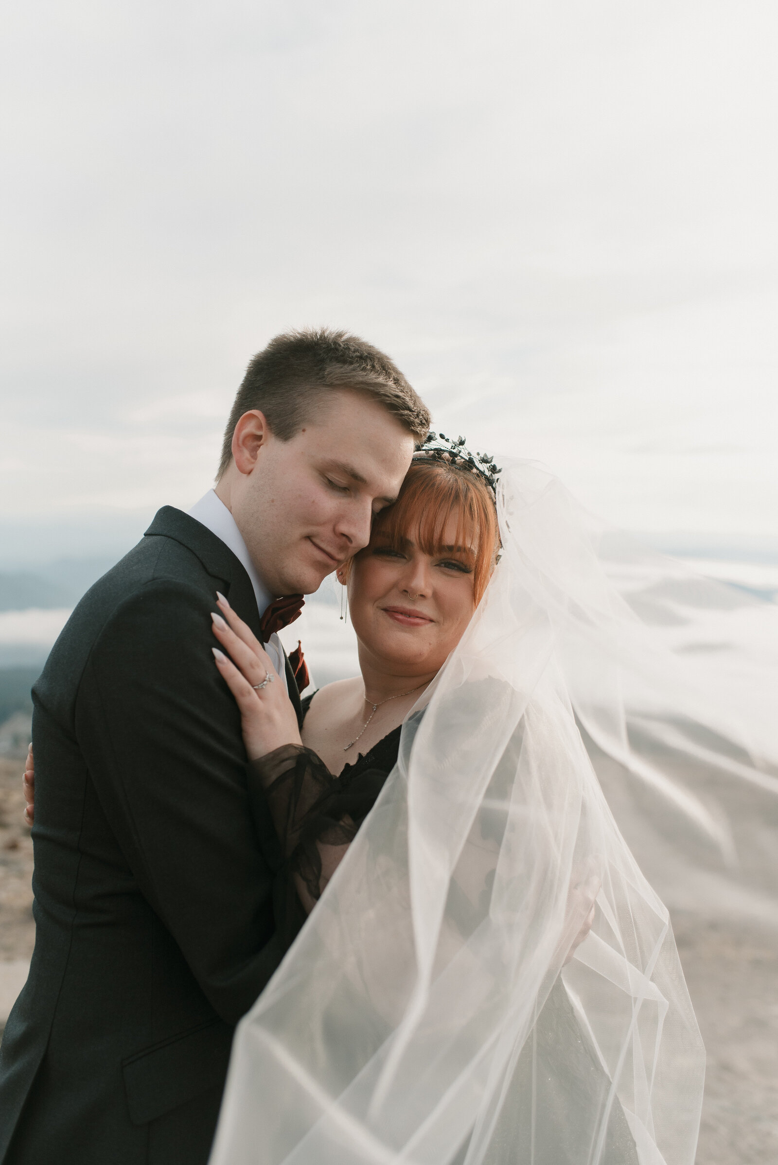 romantic photo of groom and bride in a black wedding dress
