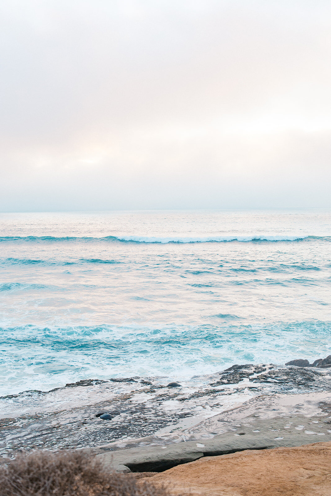 Blue water hits the shore in San Diego California 