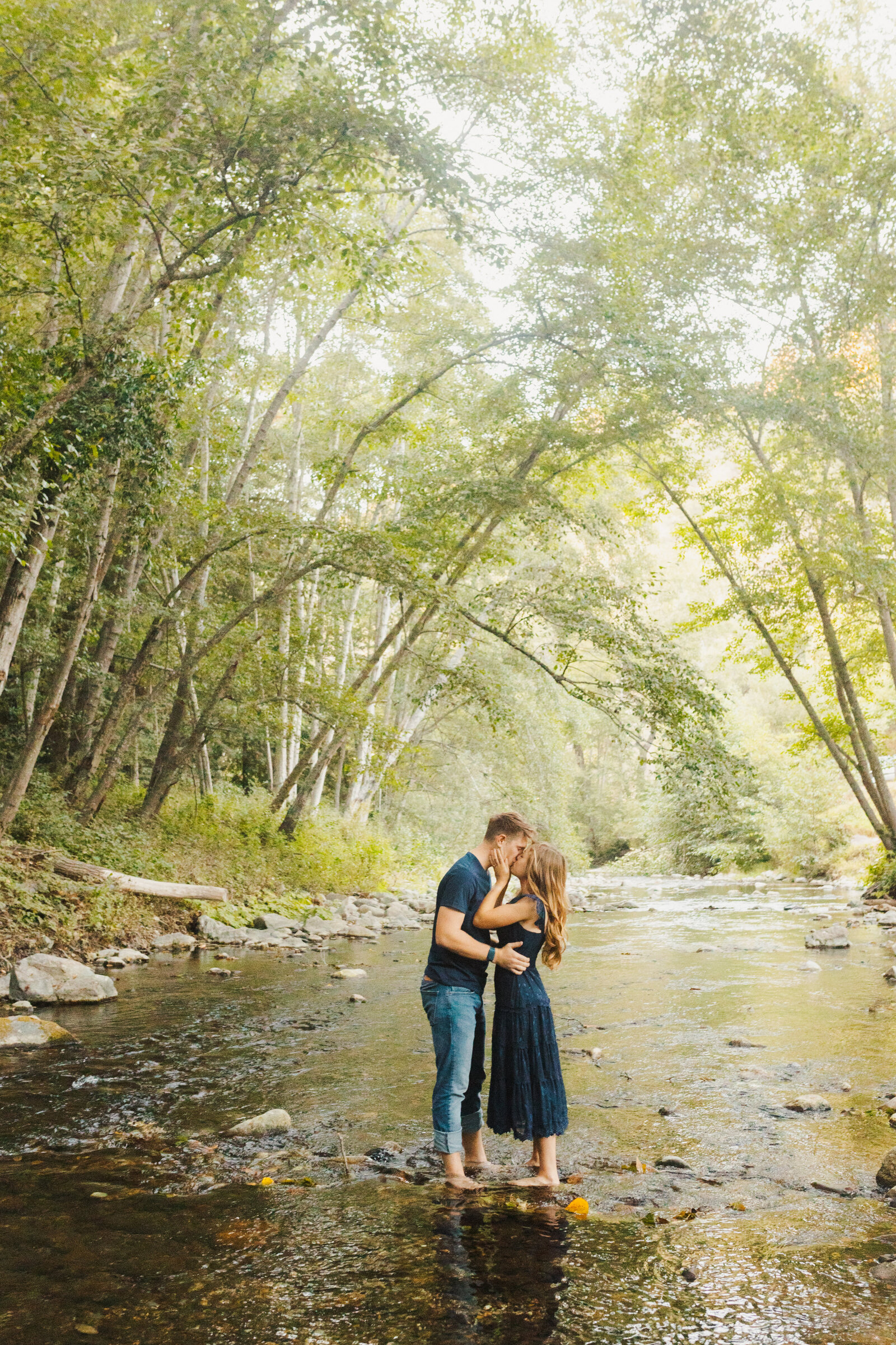 A couple poses for their engagement photos in Big Sur, California.