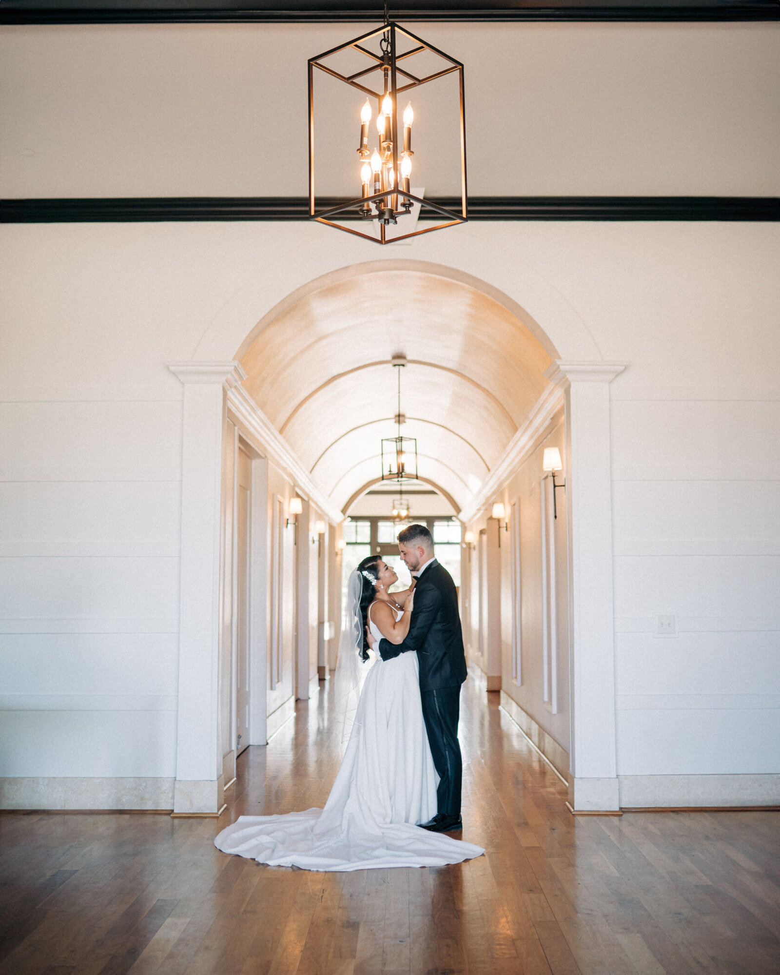Bride and Groom pose inside of The Dalmore Fossil Creek at their wedding in Fort Worth