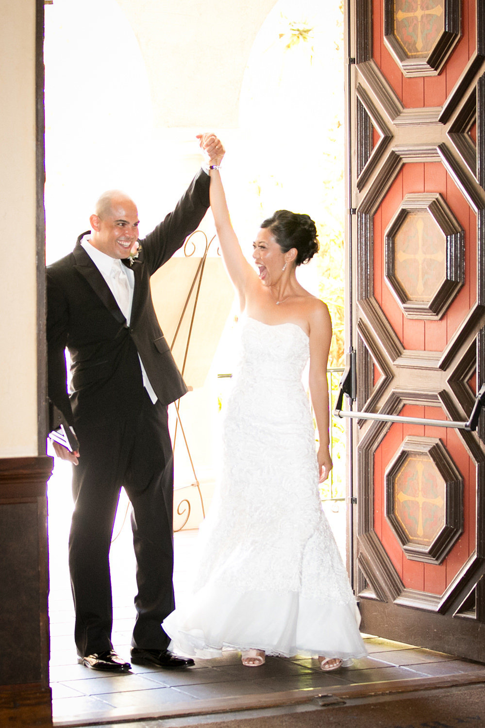 bride and groom walking into reception at the prado