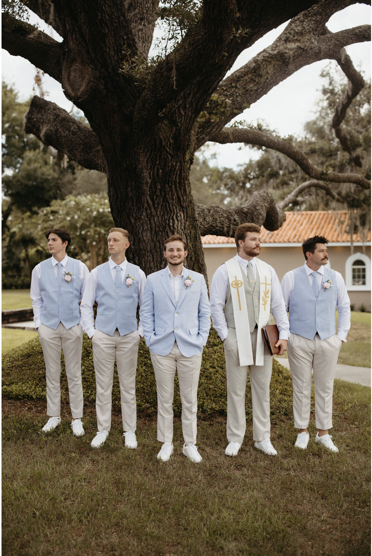 Groomsmen outside in front of groom suite