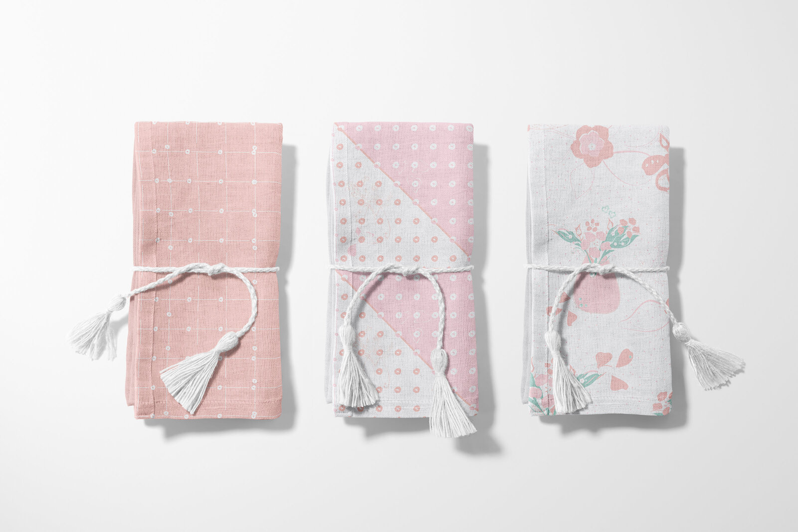 pink and white floral and patterned fabric napkins