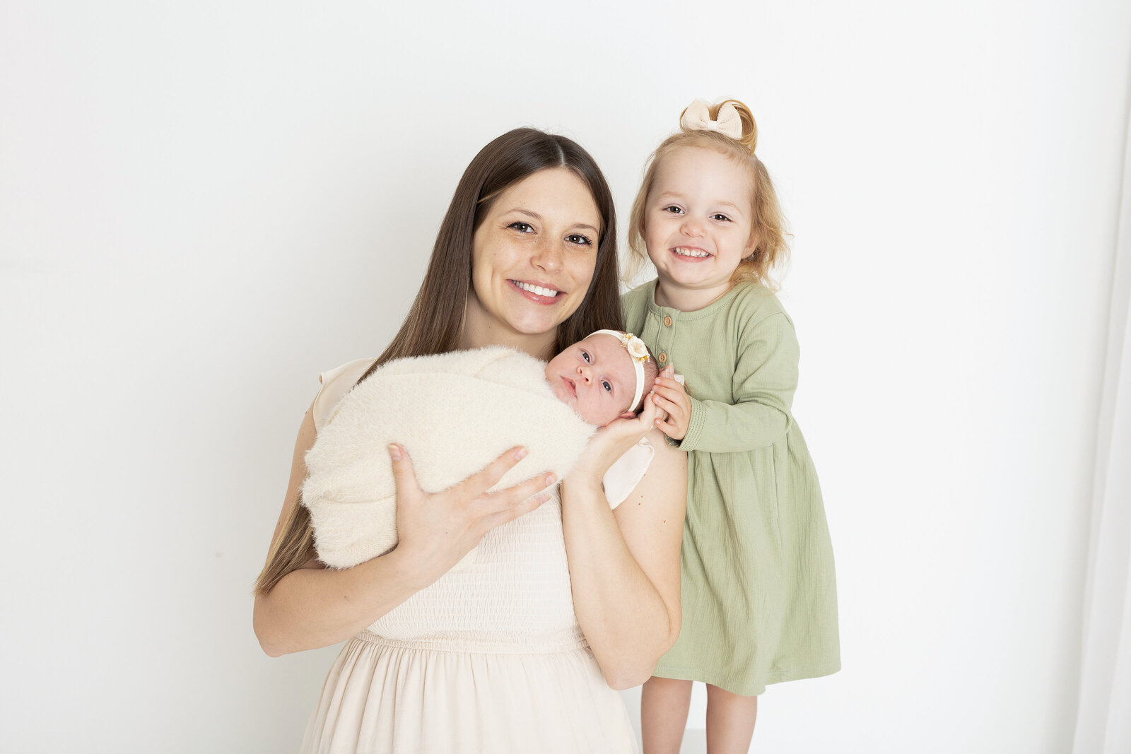 mama and her girls during a newborn session