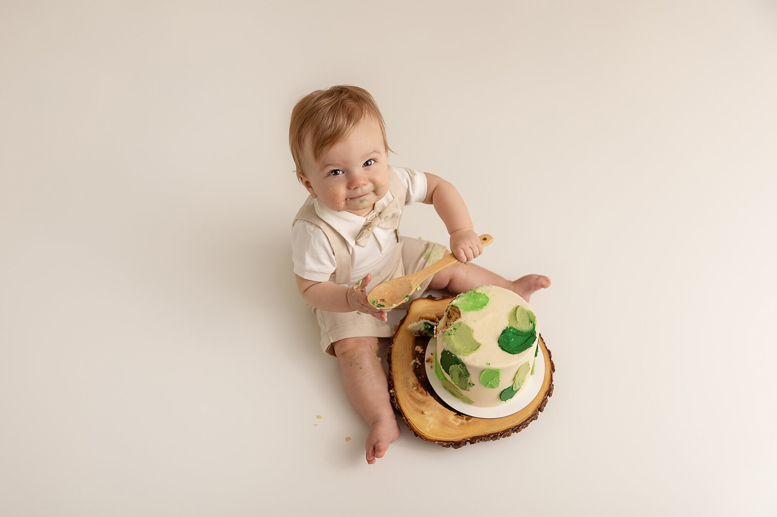 overhead view of boy eating cake