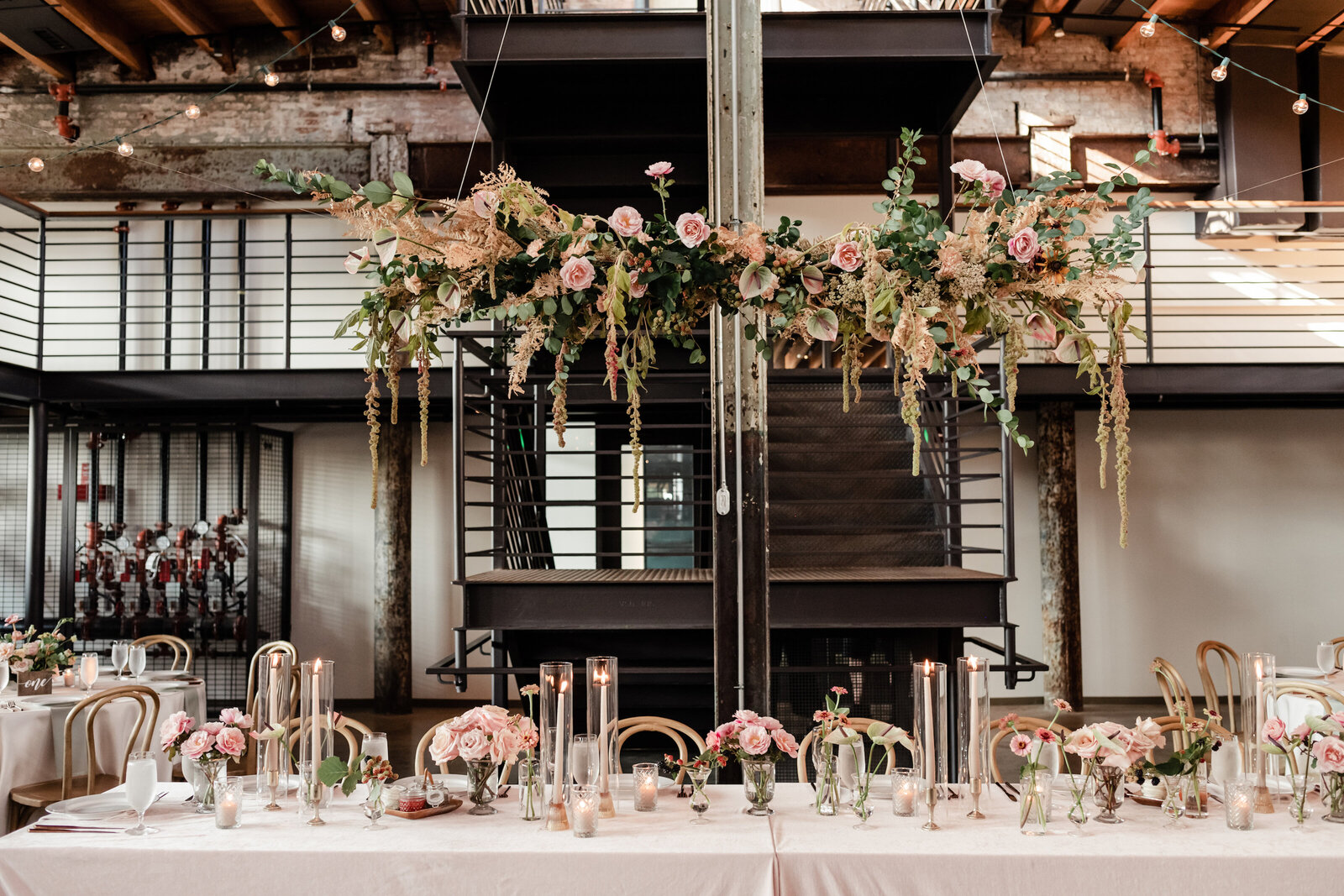 Head table hanging installation roses, anthurium and amaranthis