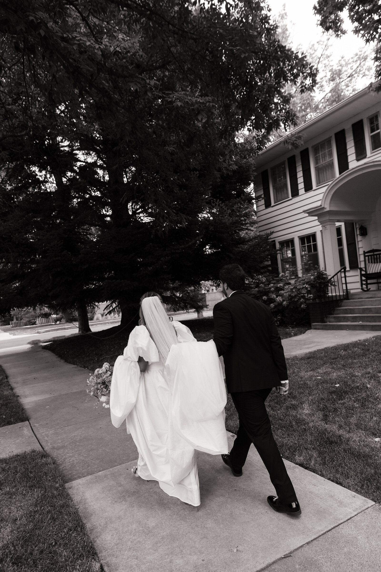 Bride and groom stroll through Downtown Boise during bridal portraits