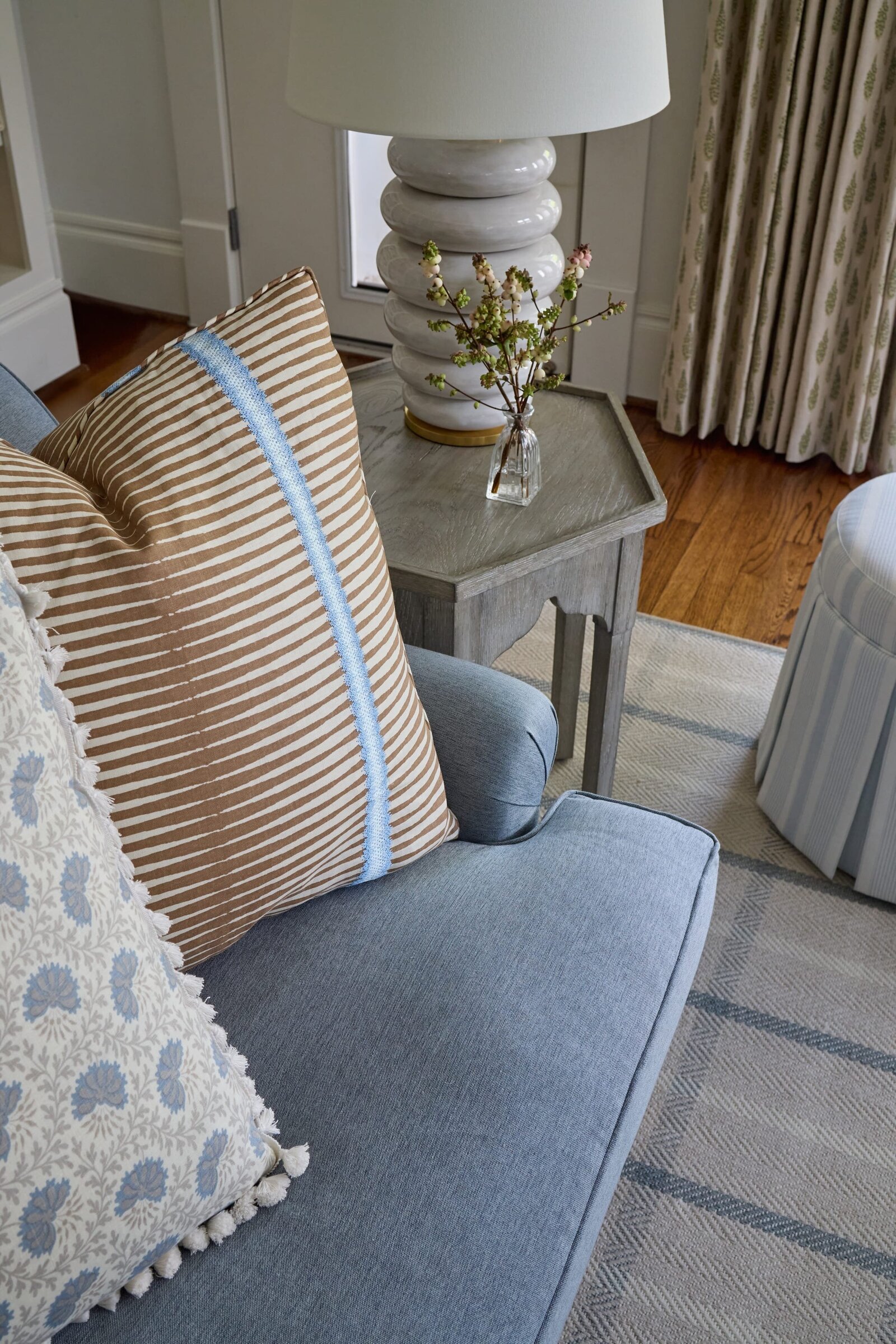 vision and hammer living room blue sofa with accent pillows and rug