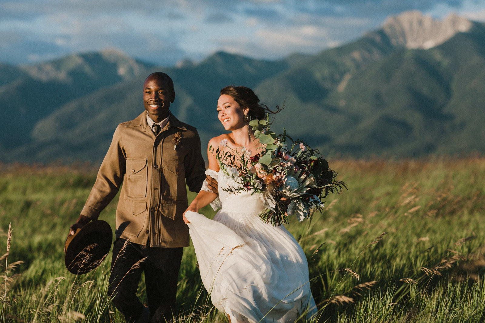 Bride and groom models strolling through the open fields in Missoula, for this styled adventure wedding shoot.