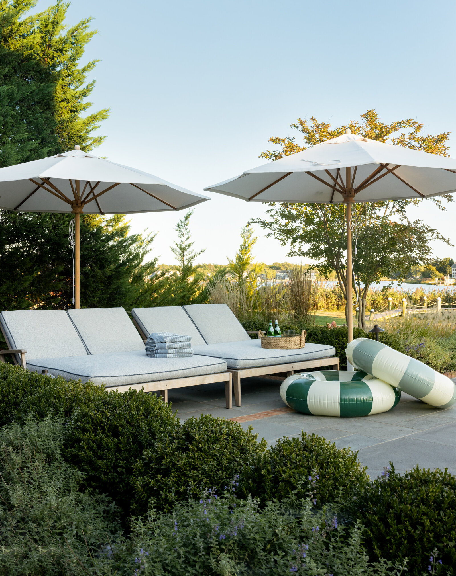 HAMPTONS STYLE DOUBLE POOL LOUNGERS AND UMBRELLAS