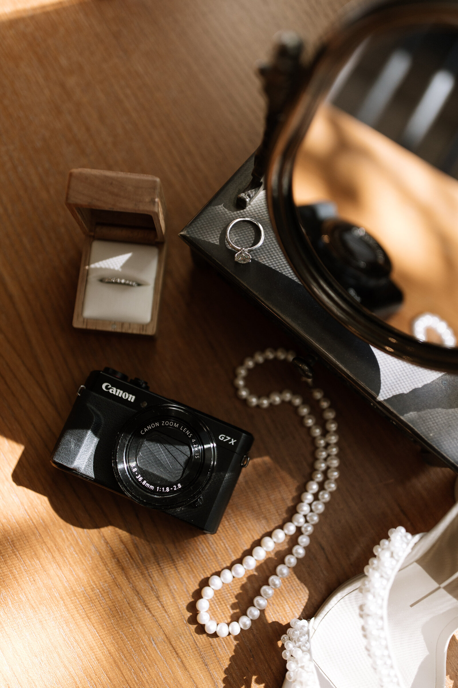 Wedding details of jewelry and film camera by Erica Rochelle, best Northern California wedding photographers