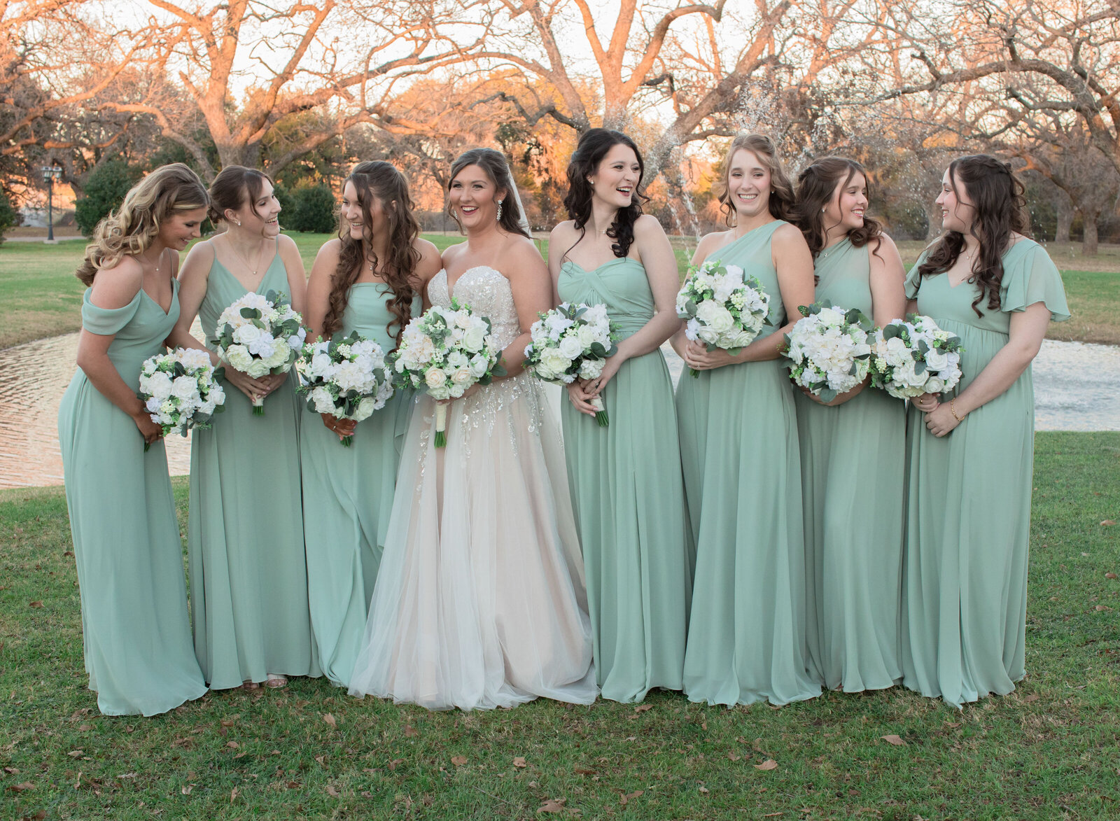 bride and bridesmaids laughing and smiling
