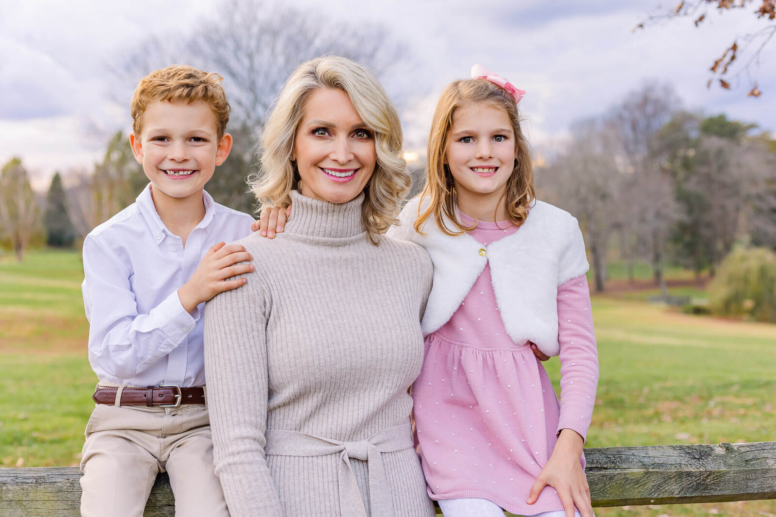 A mom with her son and daughter in a field in Burke, Virginia.