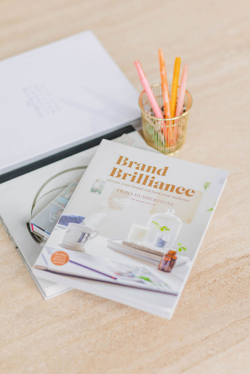 close up of the book brand brillance on a coffee table