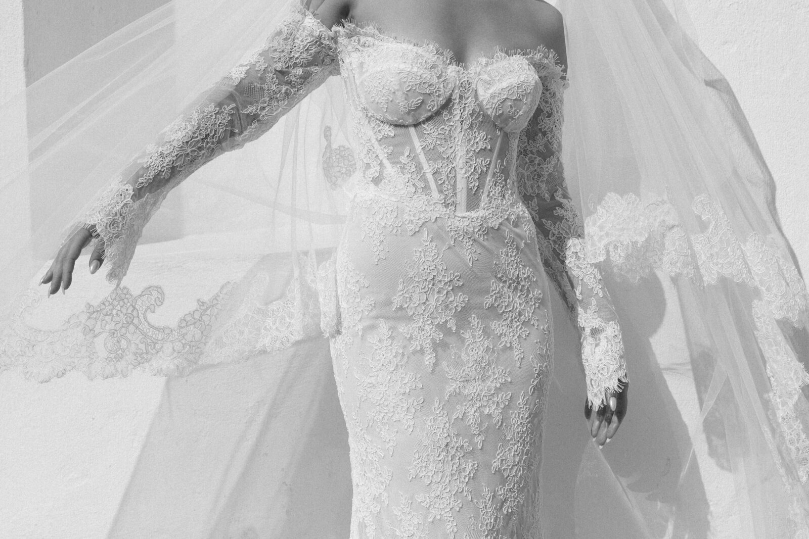 lace wedding gown with lace veil flowing 