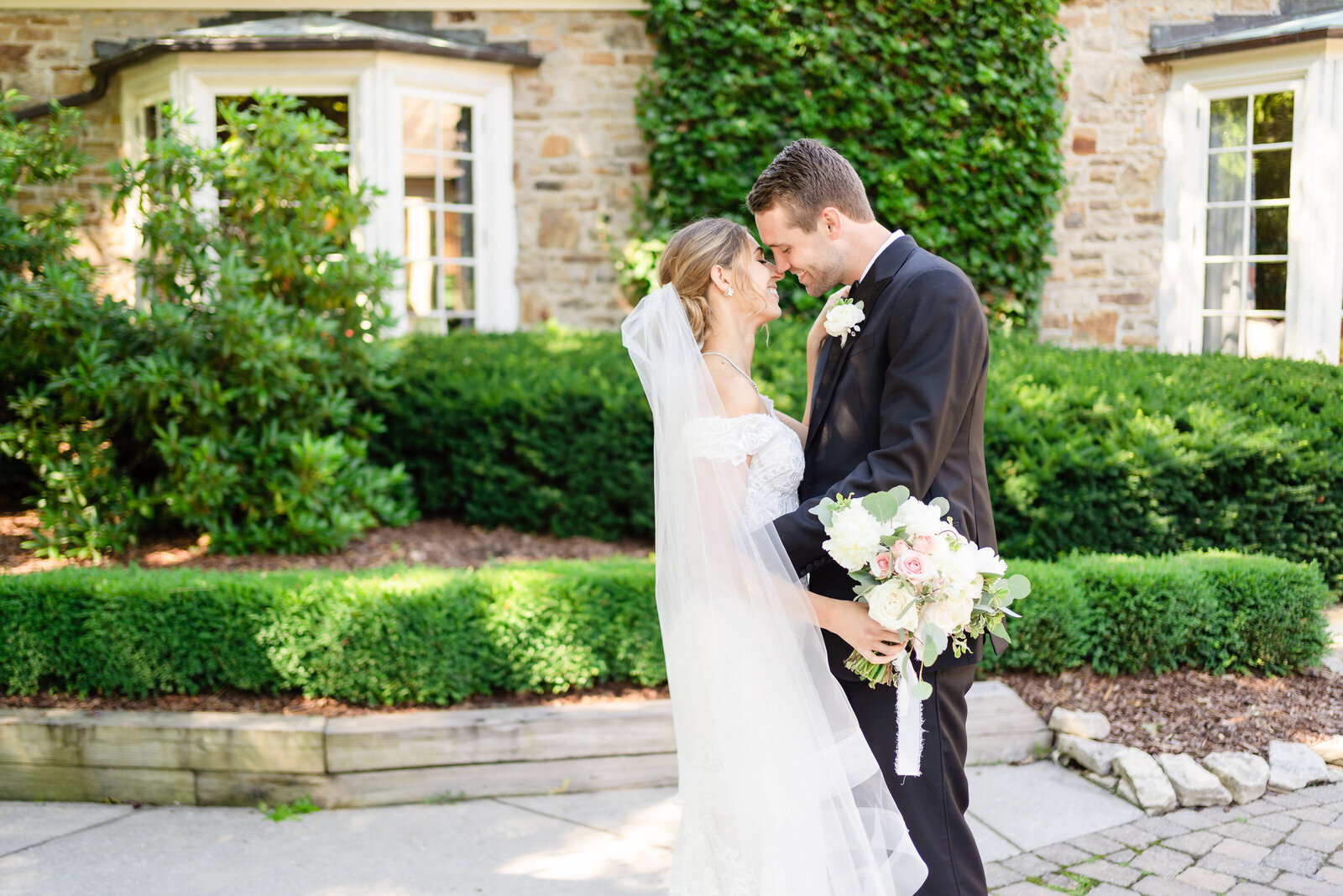 Bride and groom share a kiss following their first look at the Rocky Fork Country Club
