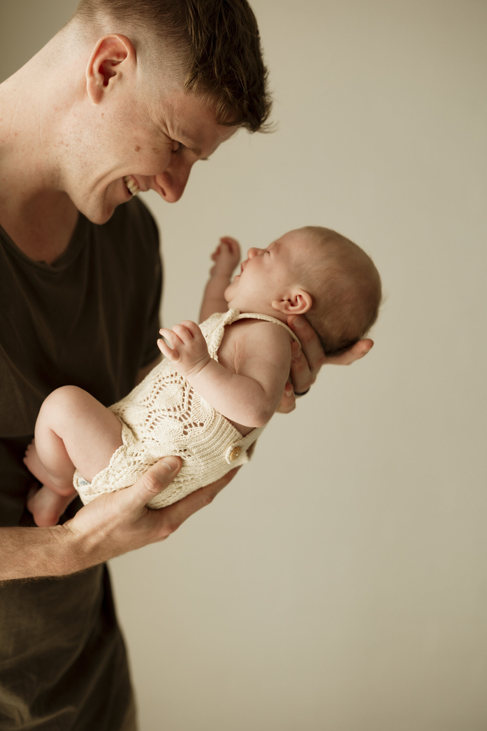 Classic newborn family portraits in Perth – simple, elegant, and focused on the connection between parents and baby.