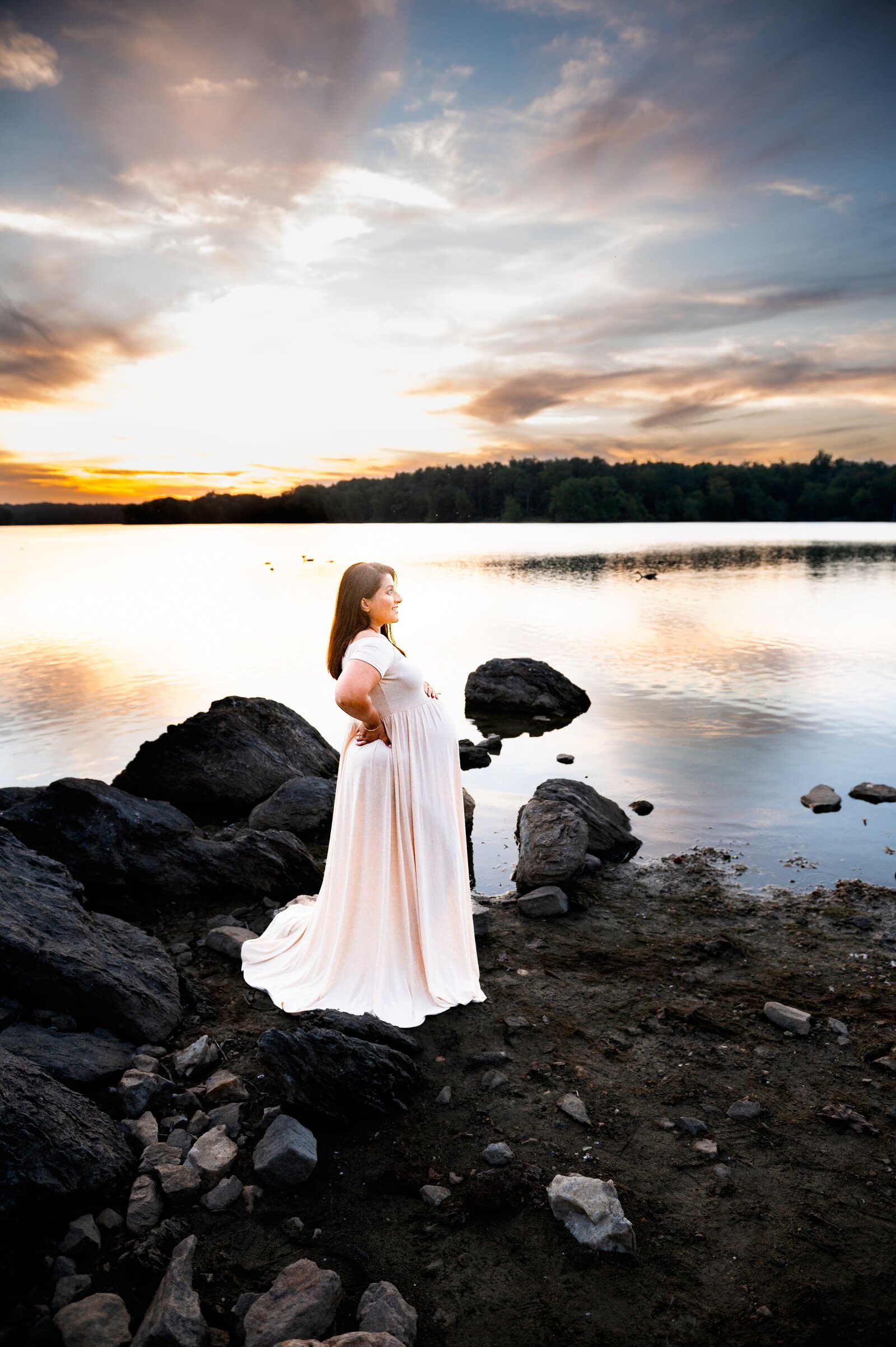 pregnant woman at Loch Raven Reservoir during a sunset maternity session