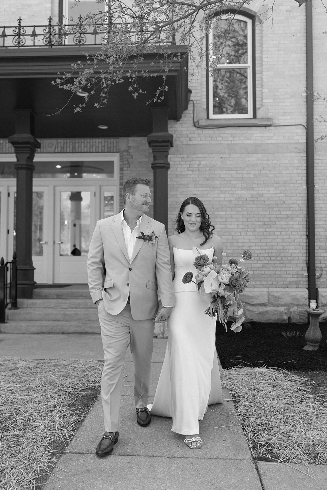 Bride with large bouquet in corset and skirt