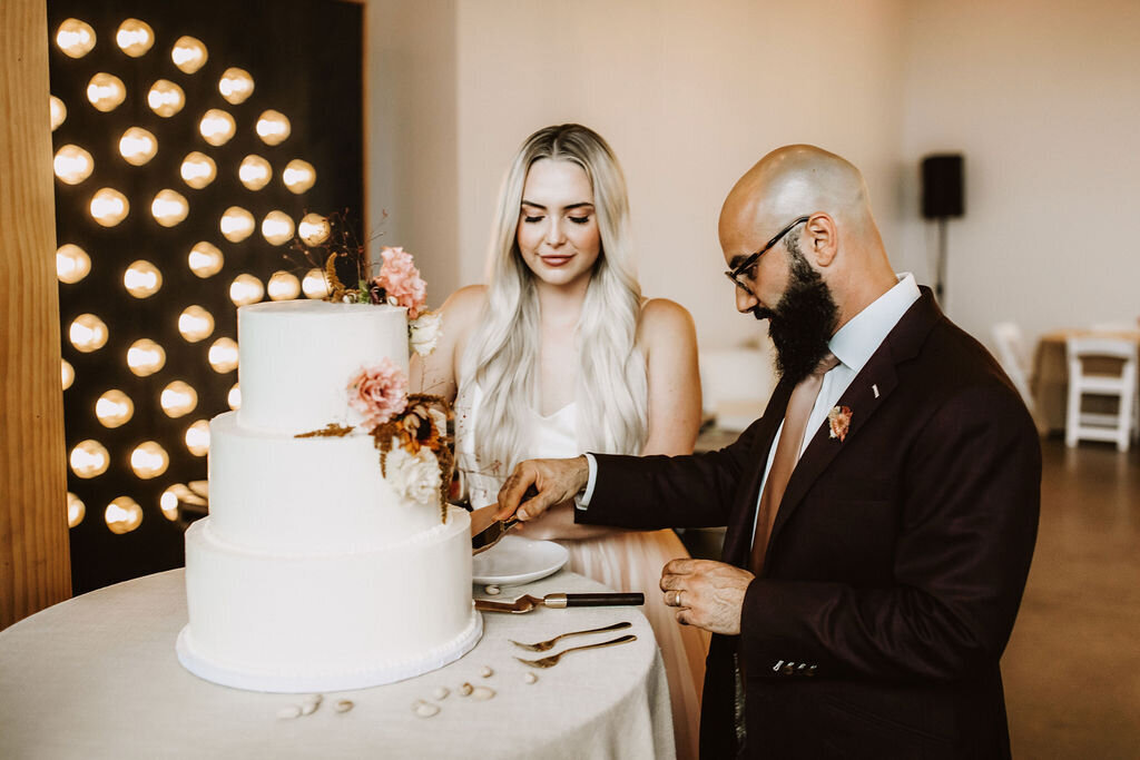 wedding-cake-cutting-tiered-pink-white-florals