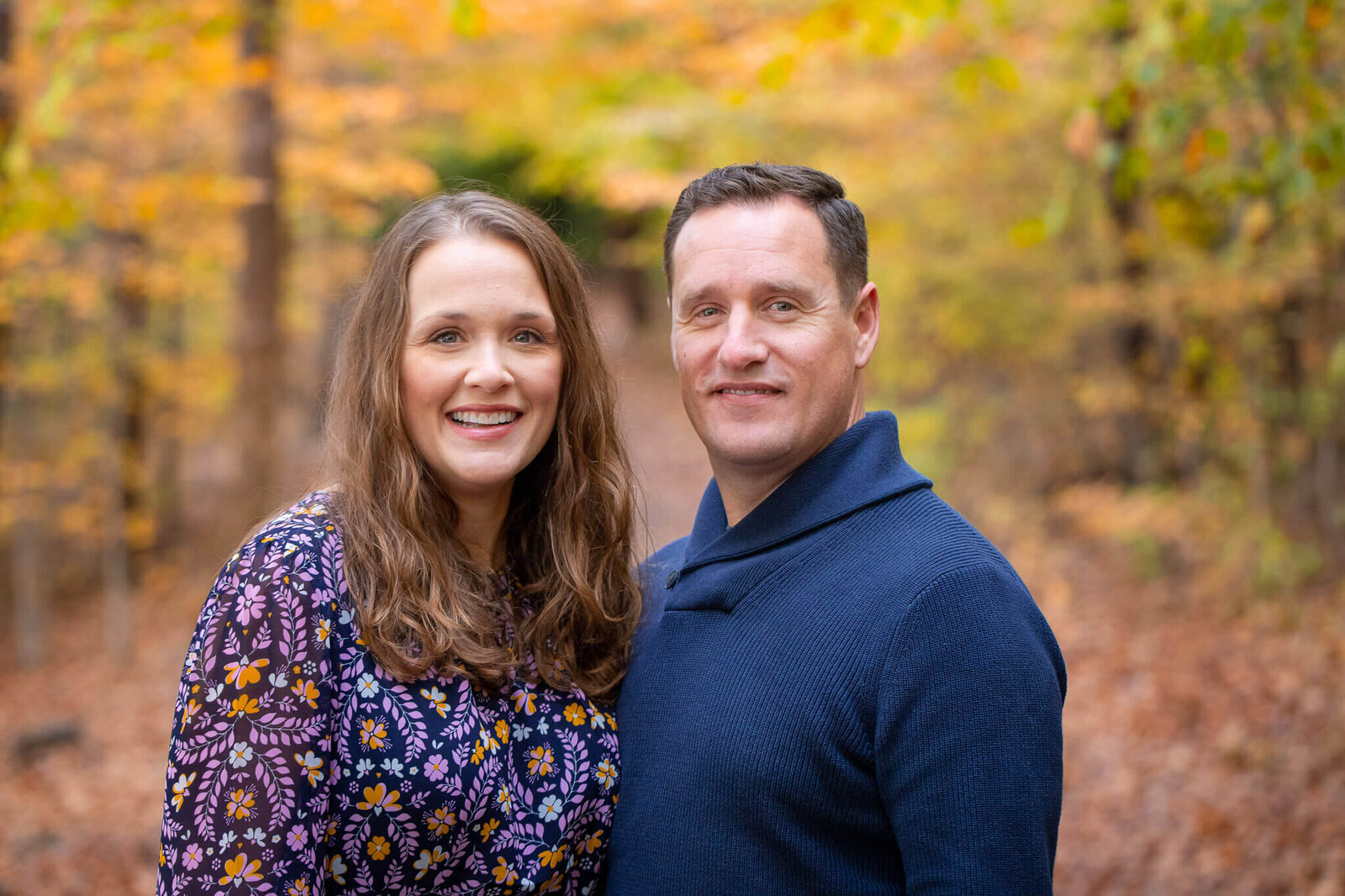A Springfield couple posing among the fall foliage.