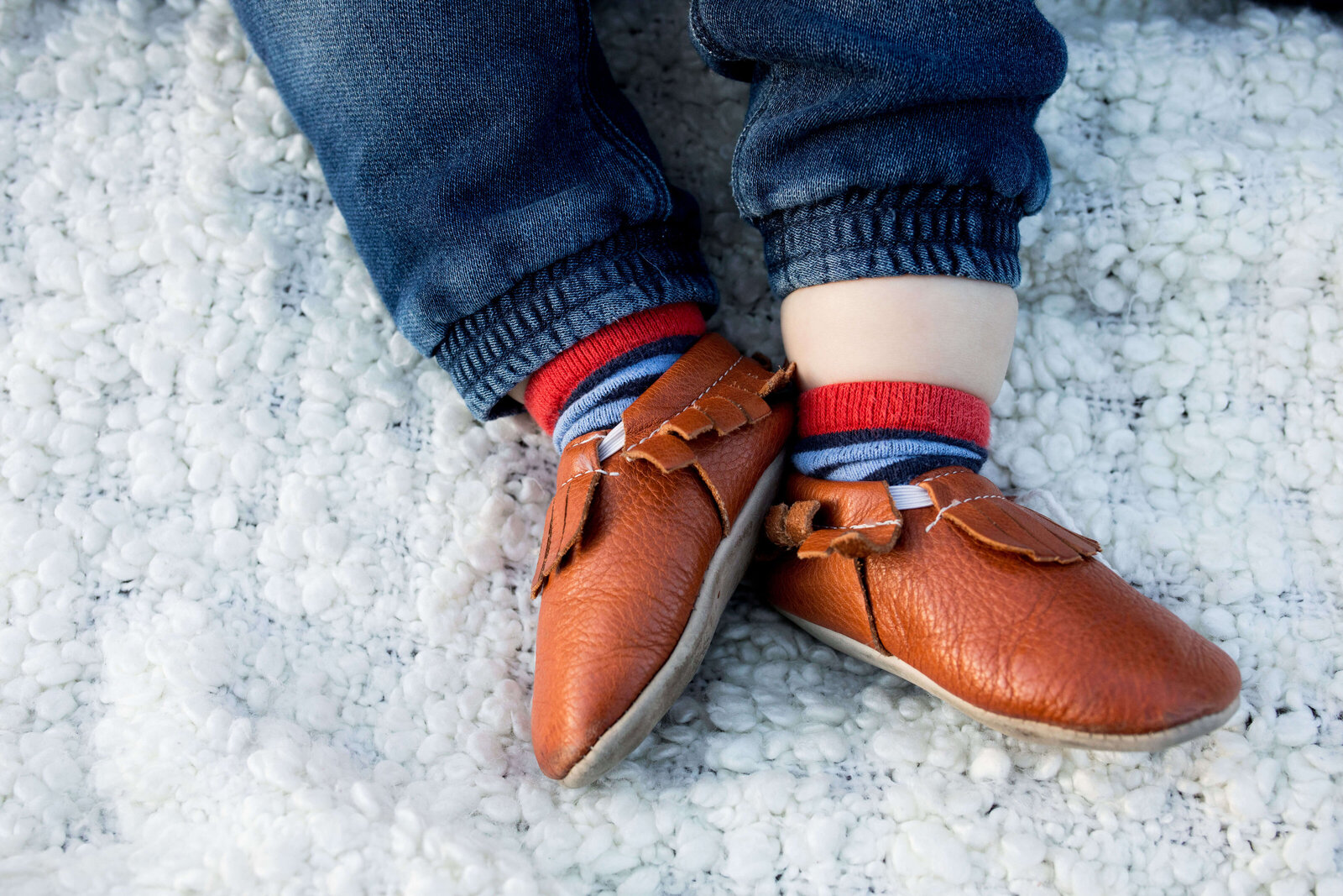 Details of little boy's shoes.