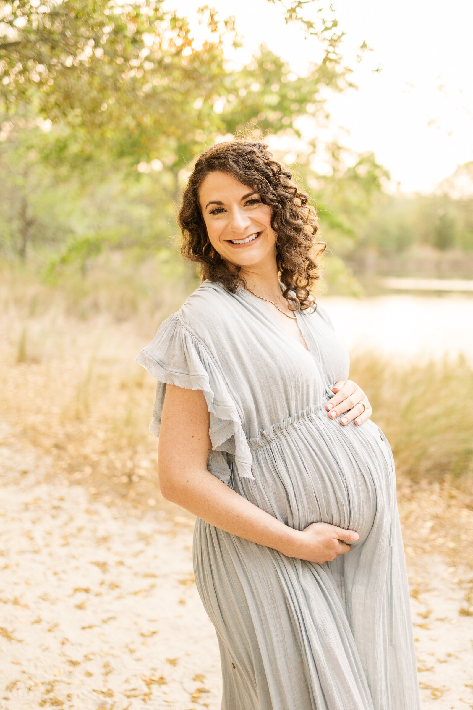 first-time-mom-smiling-maternity-portrait-virginia-beach