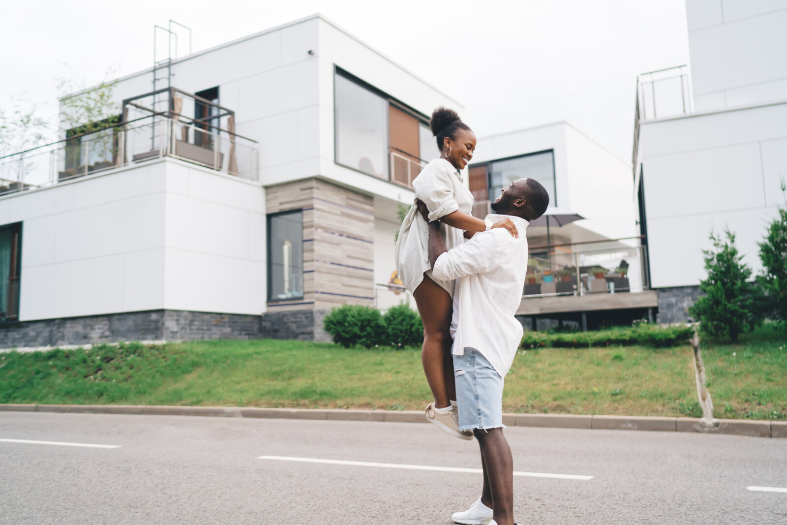 happy-black-man-carrying-girlfriend-while-standing-2024-01-17-16-19-46-utc