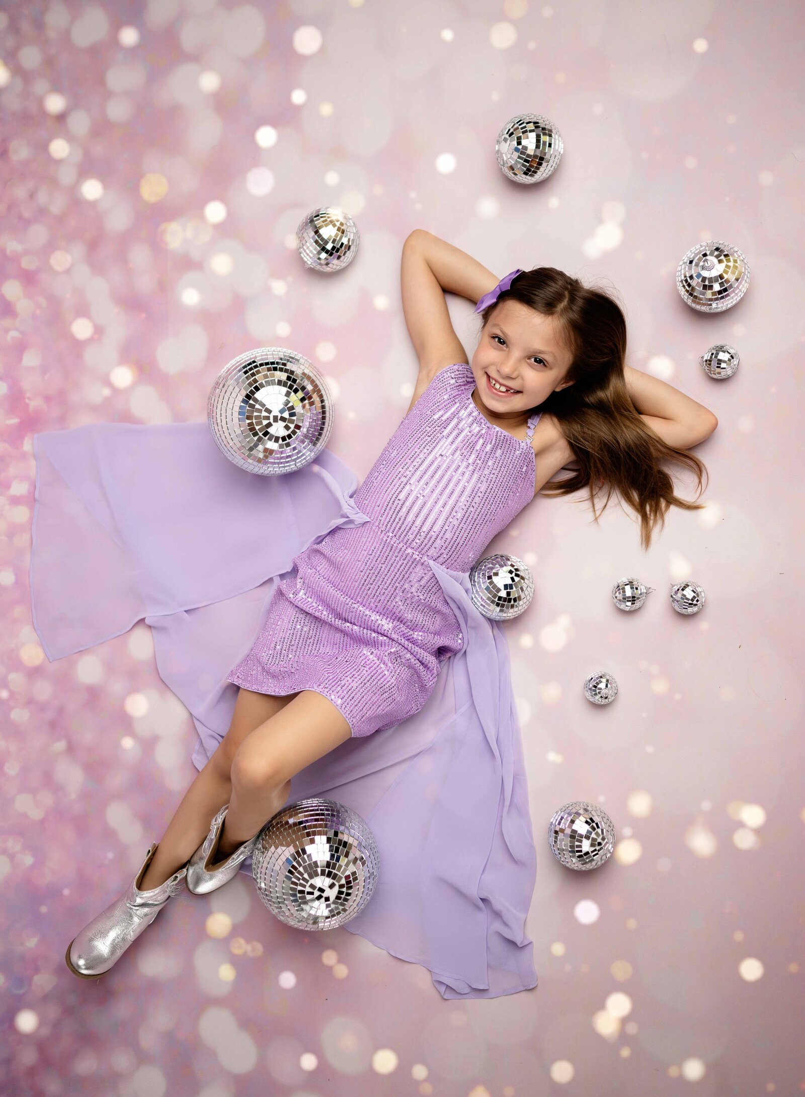 Taylor Swift styled birhday photoshoot "In my birthday Era" with girl in sparkle dress, silver boots and disco balls. Photographed by Atlanta Birthday Photographer.