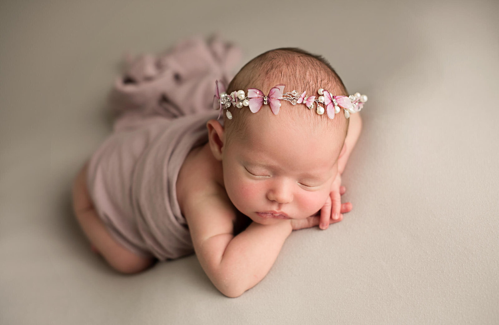 sleeping baby girl with butterfly halo