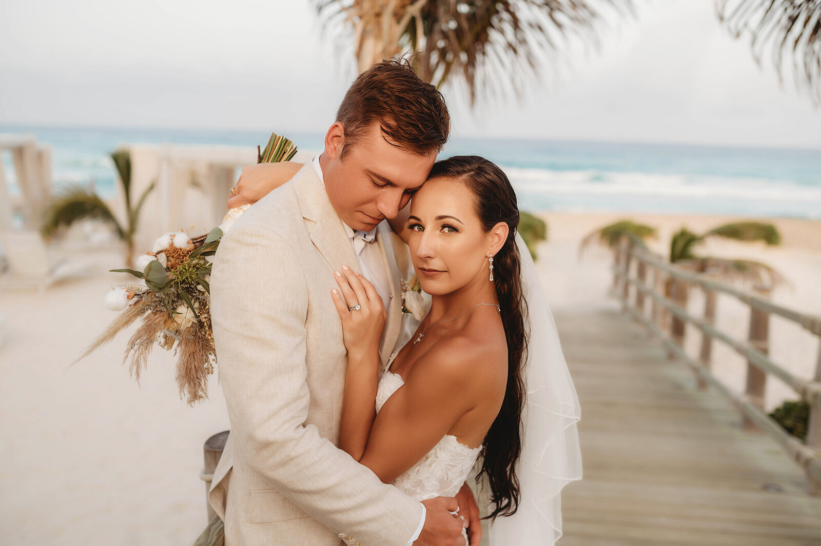 Newlyweds embrace for portraits after their Elopement Ceremony at Live Aqua Resort in Cancun, Mexico.