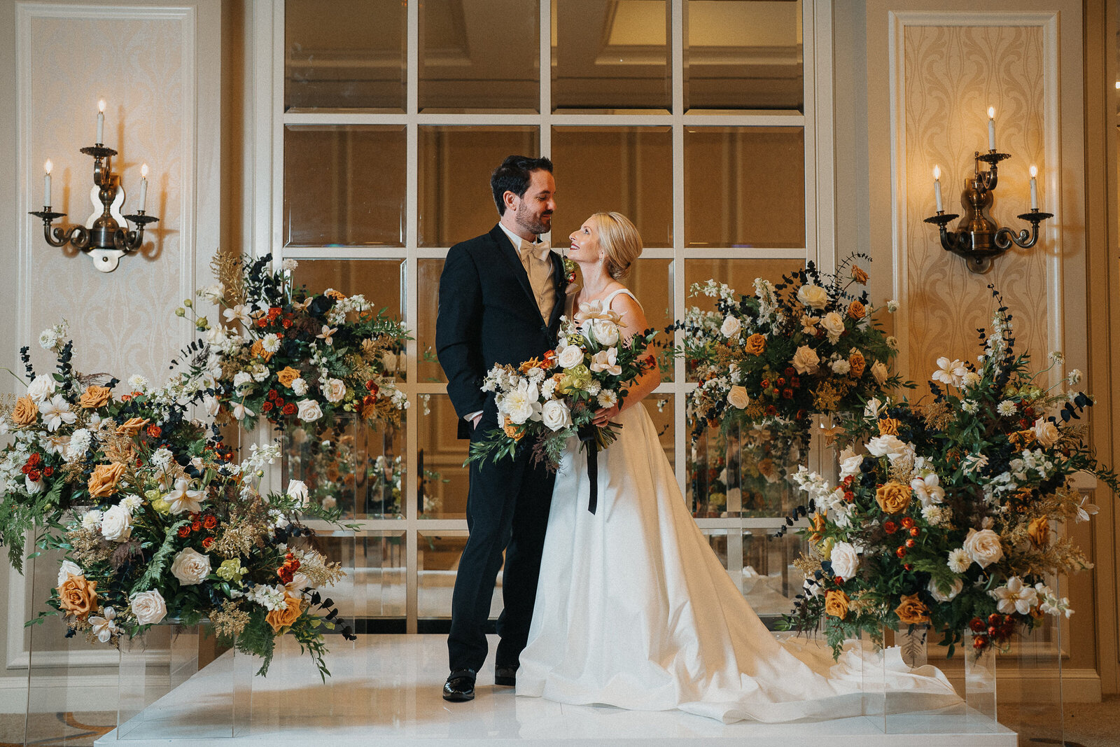 Romantic floral backdrop filled with texture and color, created by The Floral Eclectic for a ceremony in Dallas, TX.
