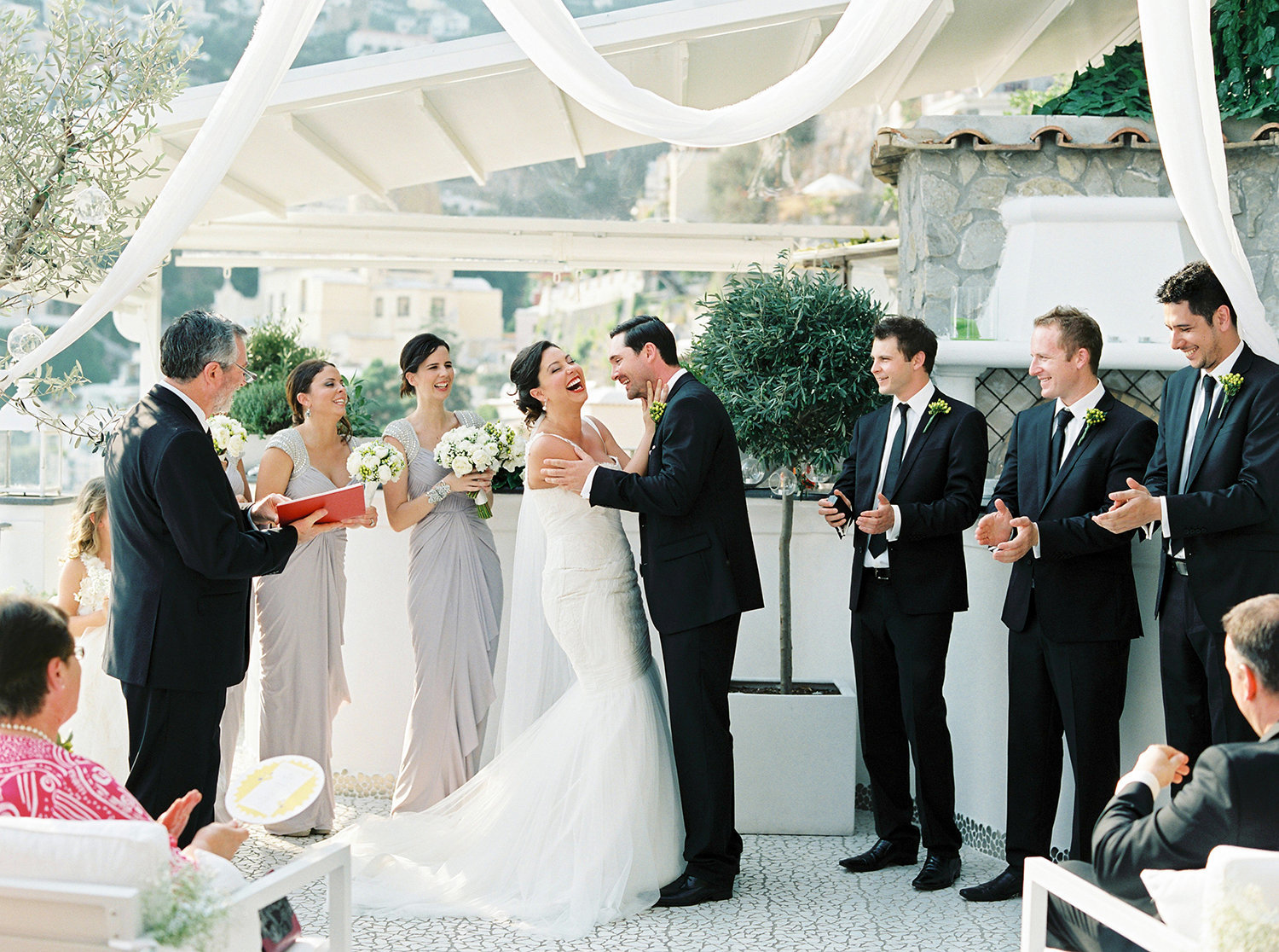 Wedding ceremony in Positano and the bride is laughing out loud